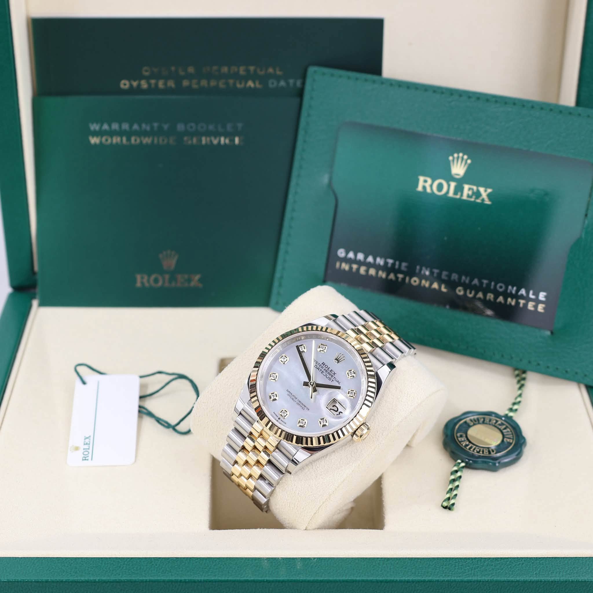 May be an image of wrist watch and text that says 'WARRA WORL ROLEX GARANT INTERN ONAL NALE NTCE 떡 + جع A 製 12N o P H 雲 பபரர் 3 살 0 ジ ROLEX さ 산 74 REUE 88I%'