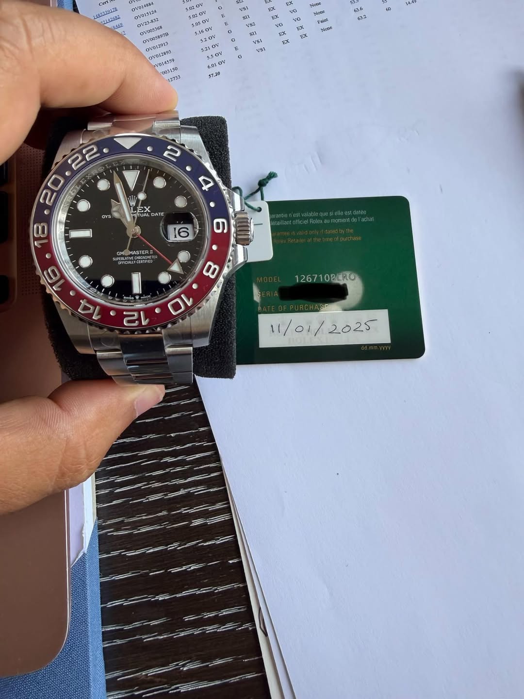 May be an image of wrist watch and text