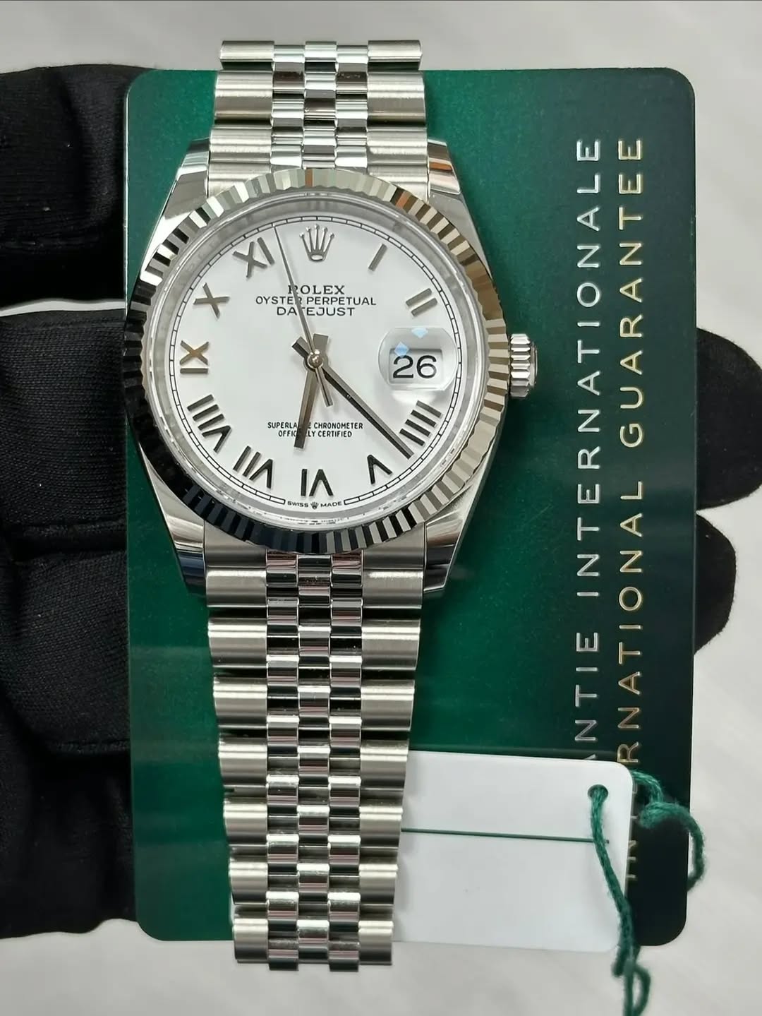 May be an image of wrist watch and text that says 'CHRONOMETES X W X OLEX EX OYSTE TAESUSTUAL DA EJUST UAL IX 26 VIII SUPERLA IIII II۱ V SMISS MADE HADE INTERNATIONALE…