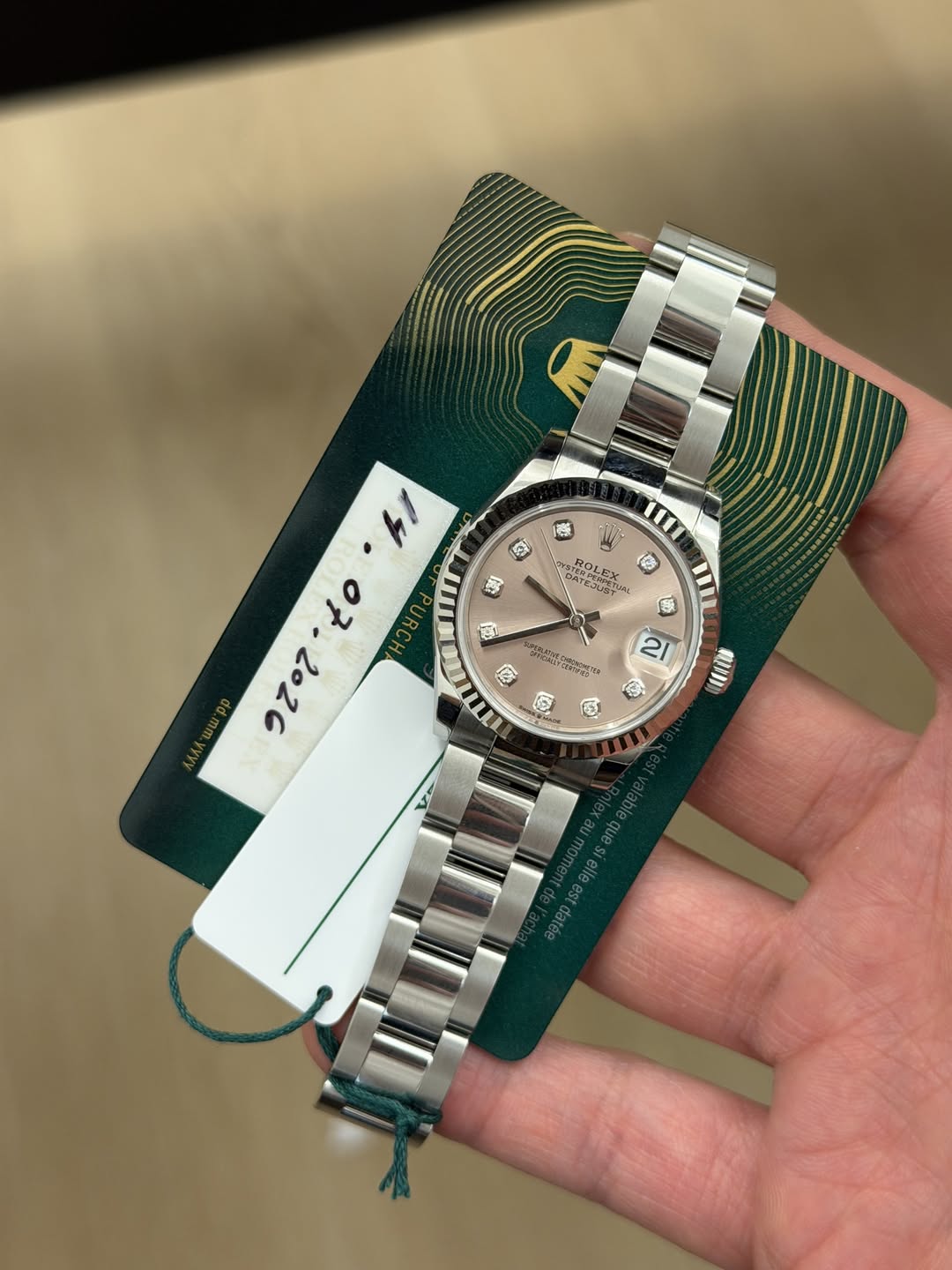 May be an image of wrist watch and text