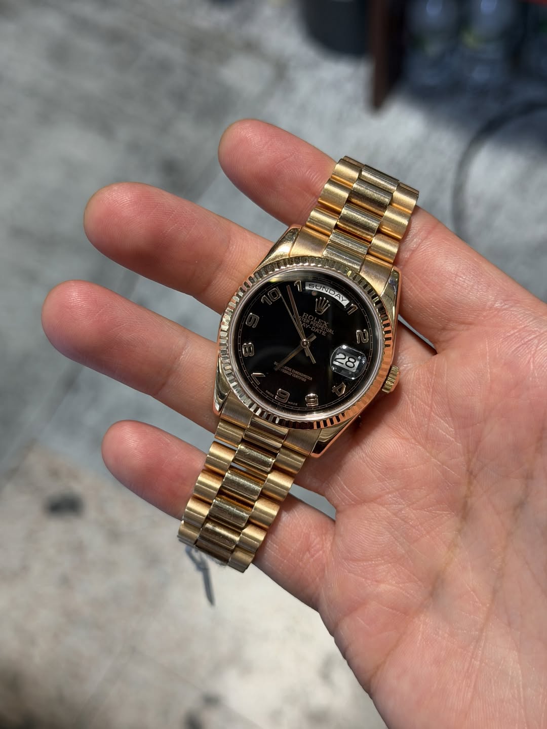 May be an image of wrist watch and text