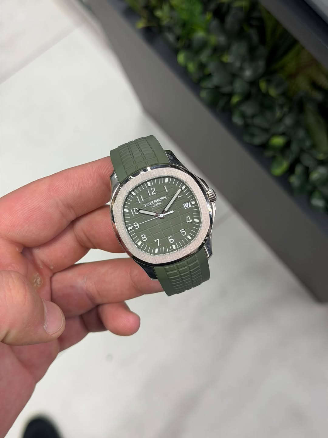 May be an image of wrist watch and text