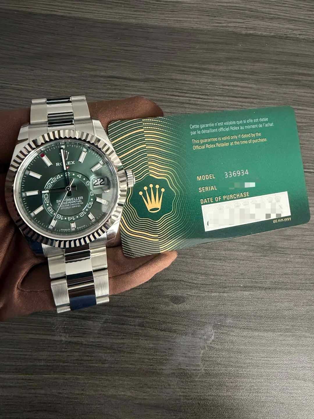 May be an image of money, ticket stub, wrist watch and text