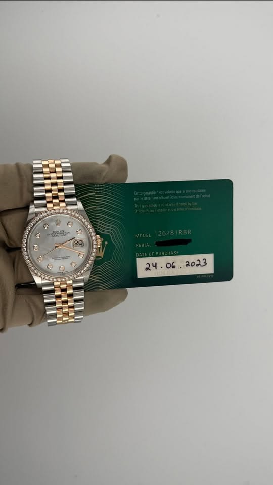 May be an image of wrist watch and text