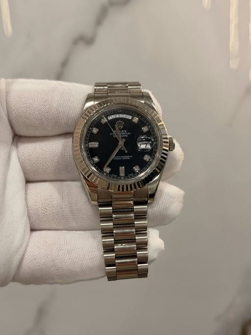 May be an image of wrist watch and text