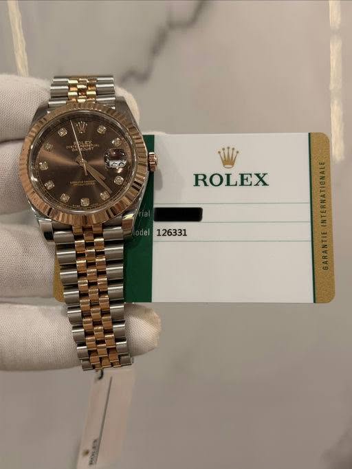 May be an image of wrist watch and text that says 'ROLEX el 126331'