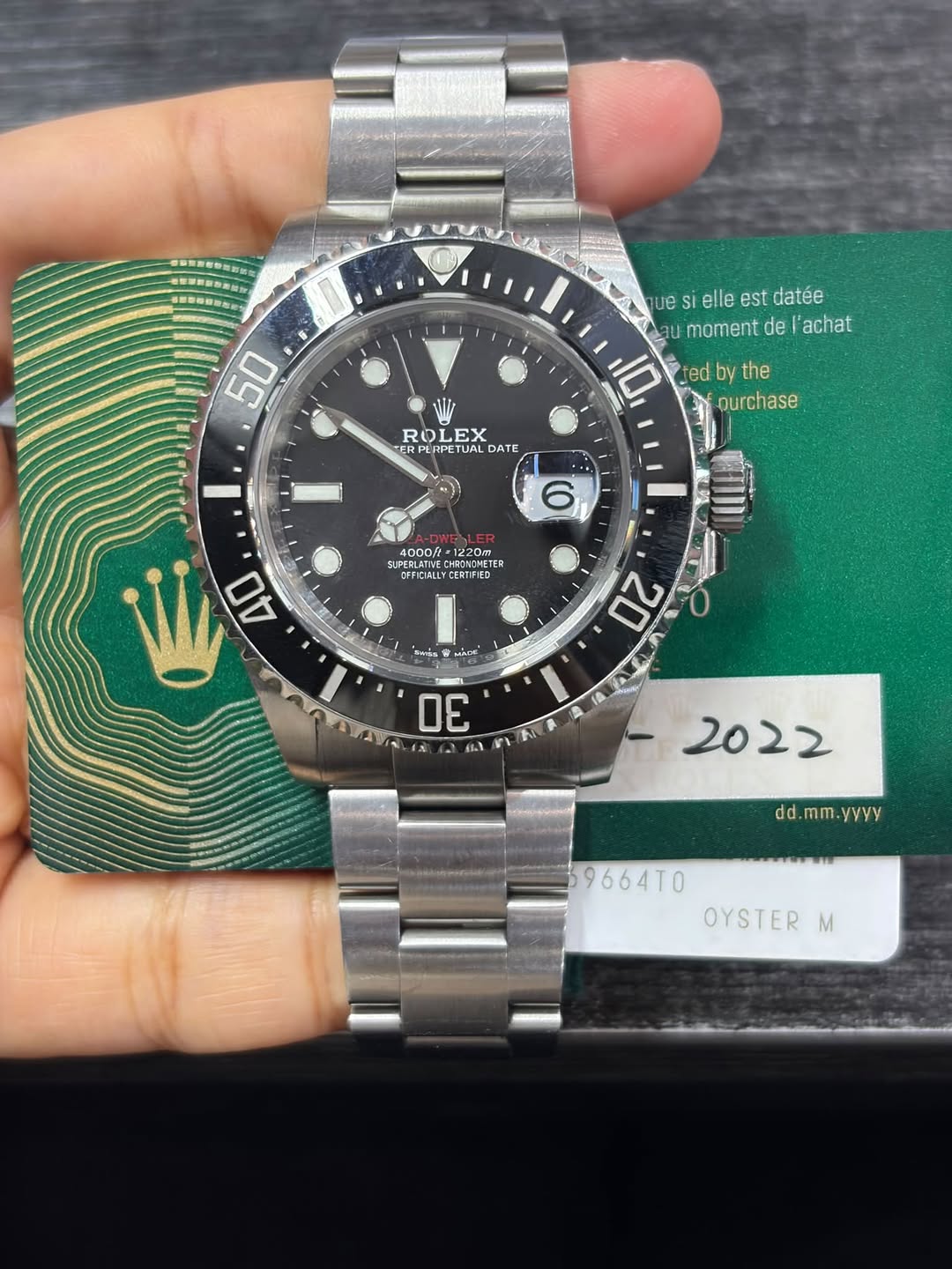 May be an image of wrist watch and text