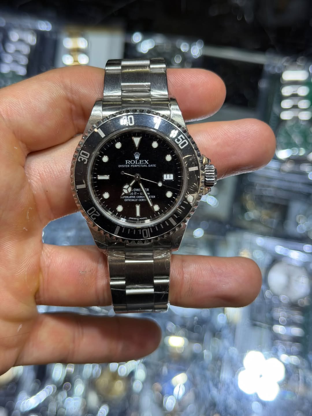 May be an image of wrist watch and text