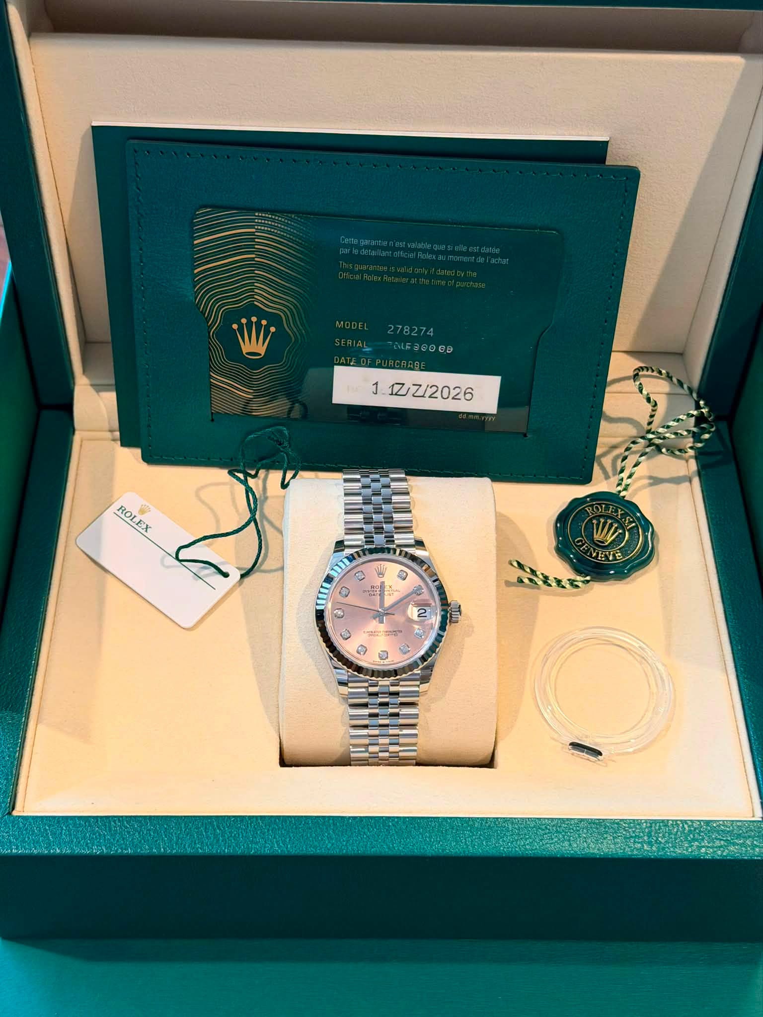 May be an image of wrist watch and text that says '1. 1Z/Z/2026 ROLEX C ١ 0 # س MO O V VEVE NE E ASTL 2'