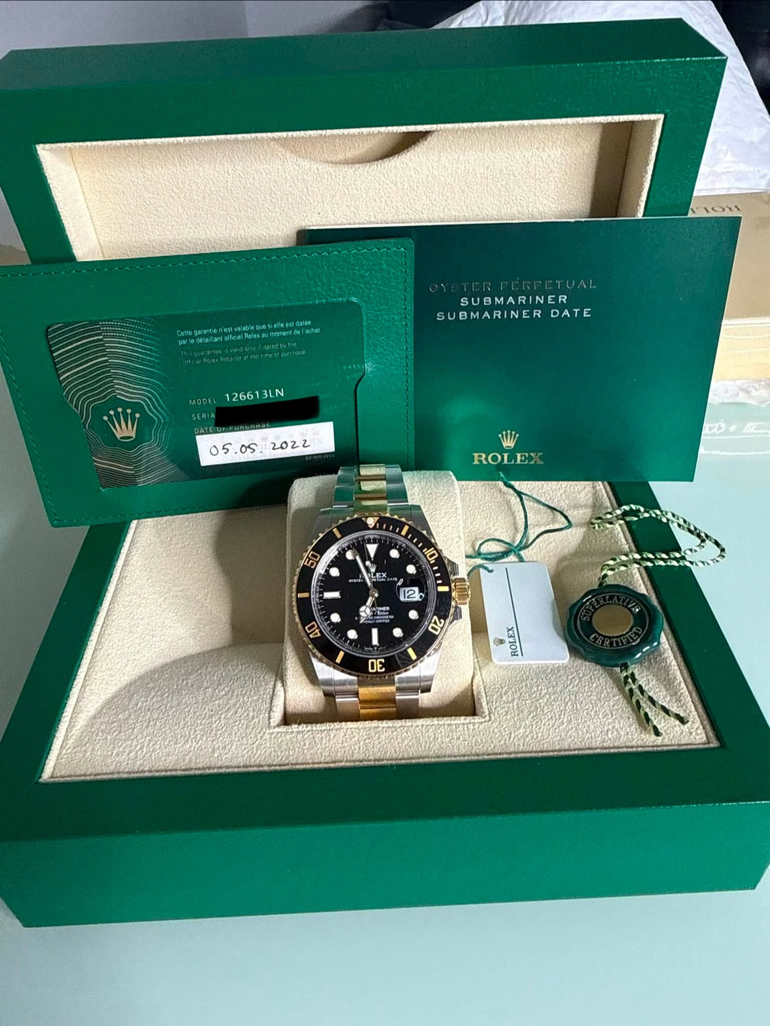 May be an image of wrist watch and text that says 'wetaeteluiare coopeelarsaaae SUBMARINER SUBMARINERD DATE MODEL 1266 126613LN 126613LN LN os. 2022 05 W ROLEX ROI 10. 12. D0 2 30…