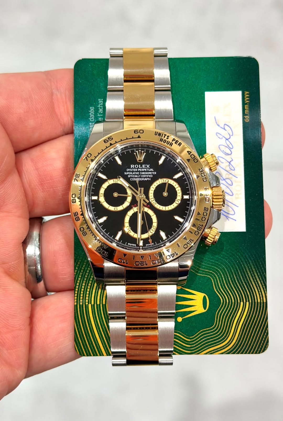 May be an image of wrist watch and text