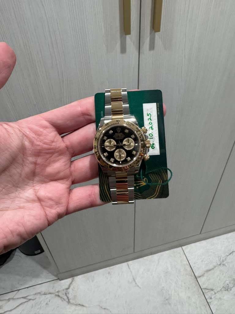 May be an image of wrist watch and text