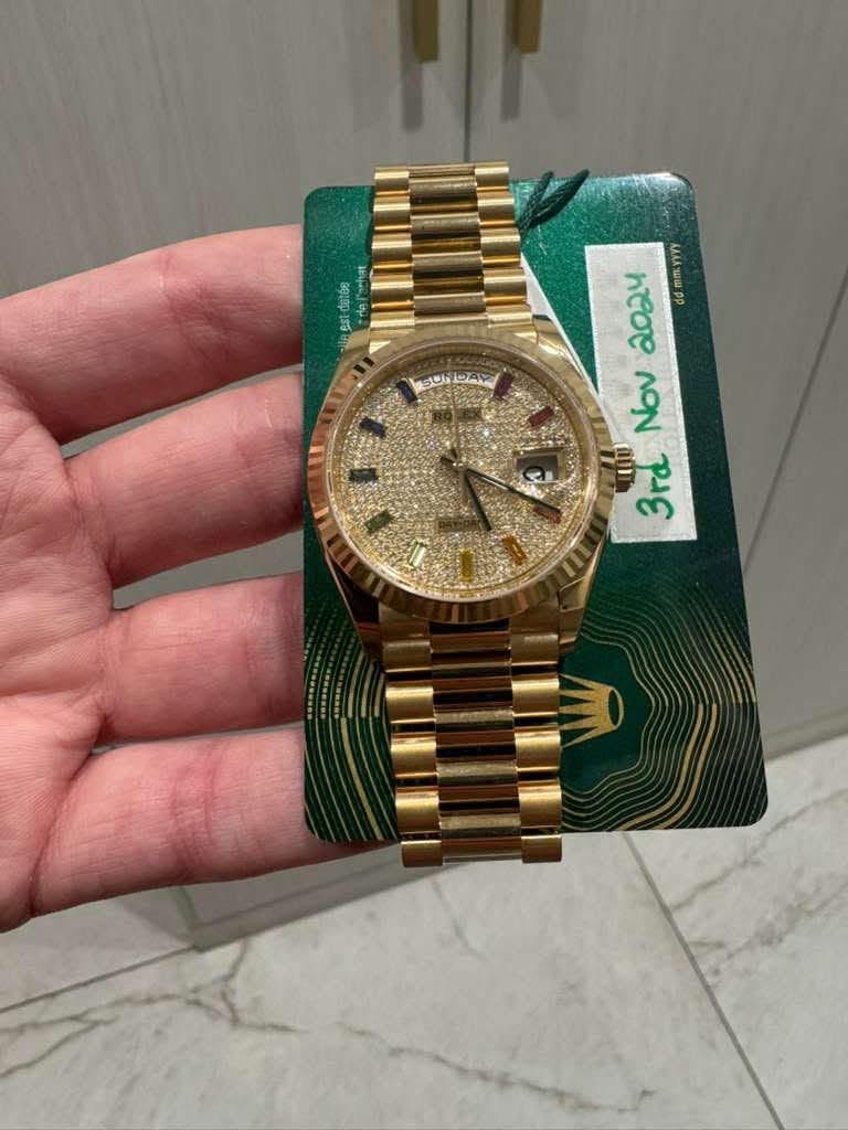 May be an image of wrist watch and text