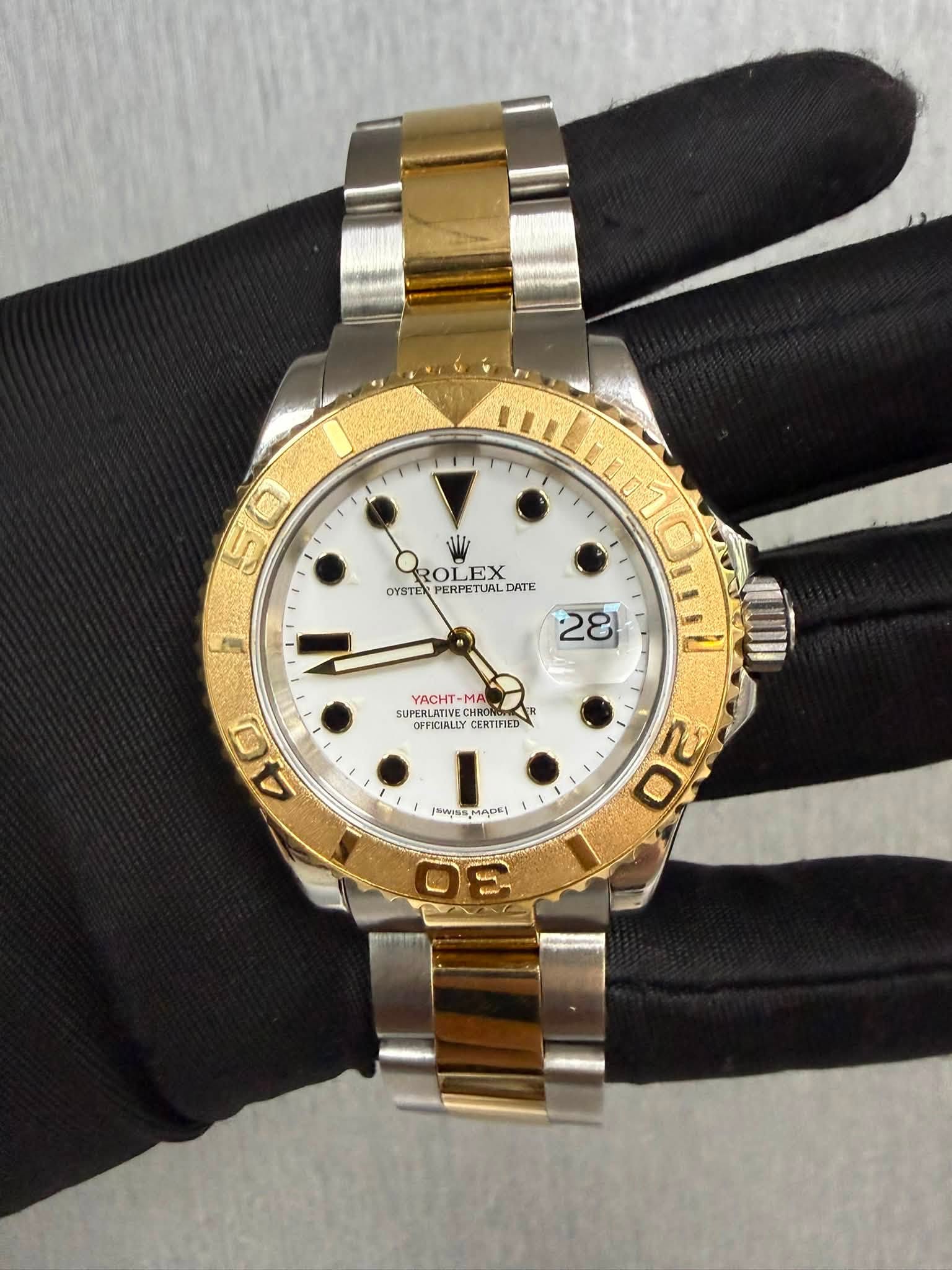 May be an image of wrist watch and text