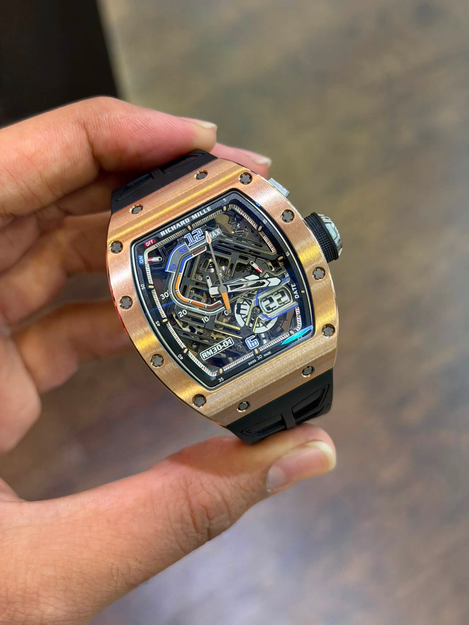 May be an image of wrist watch and text
