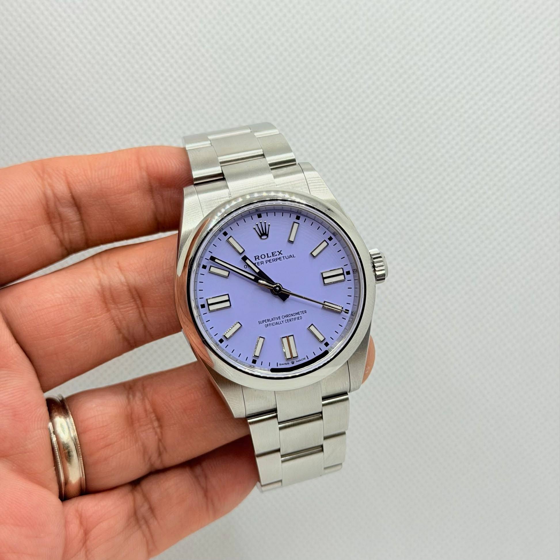 May be an image of wrist watch and text