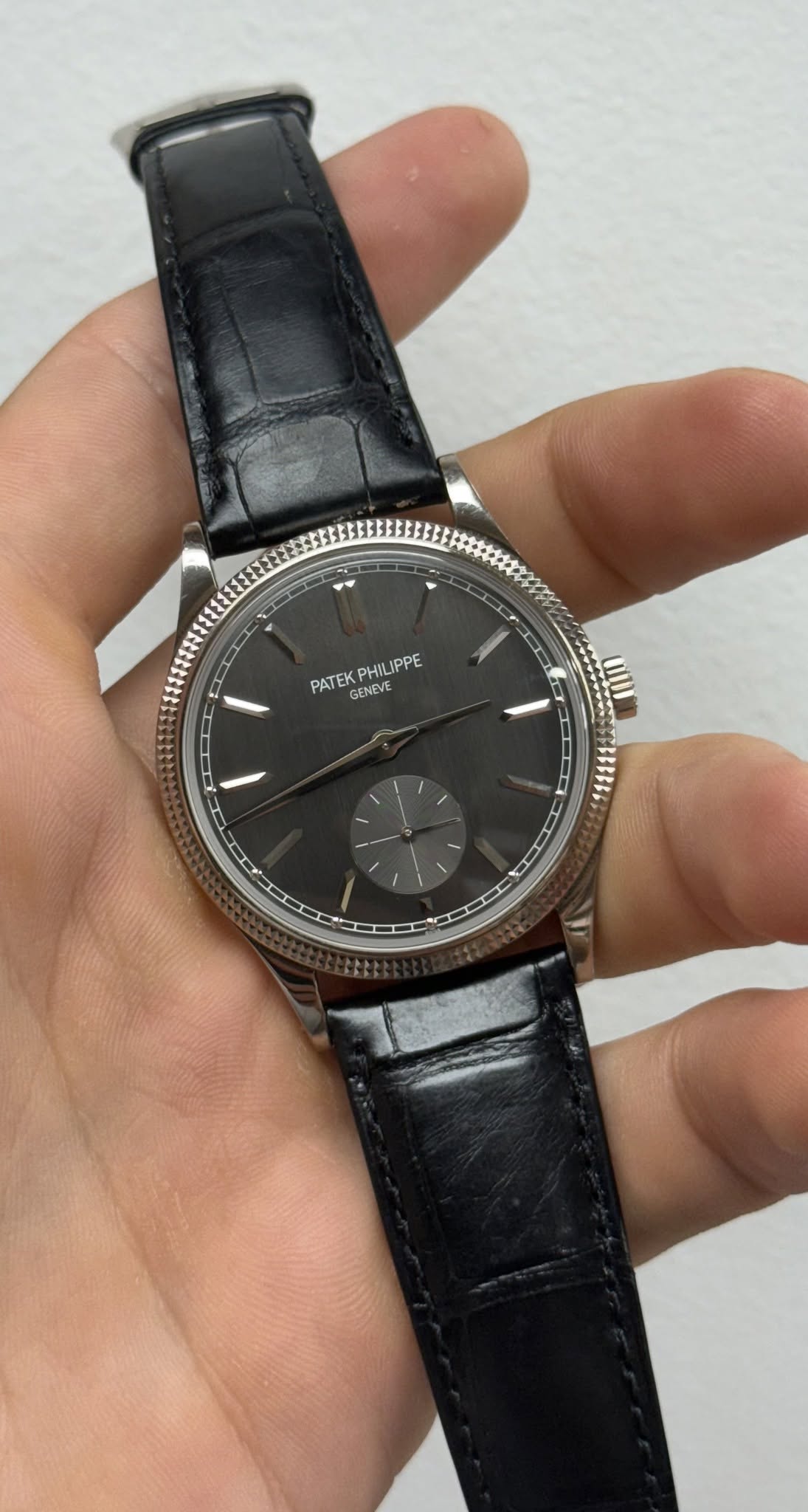 May be an image of wrist watch and text that says 'PATEK GENEVE PHILJPPE H I ב'