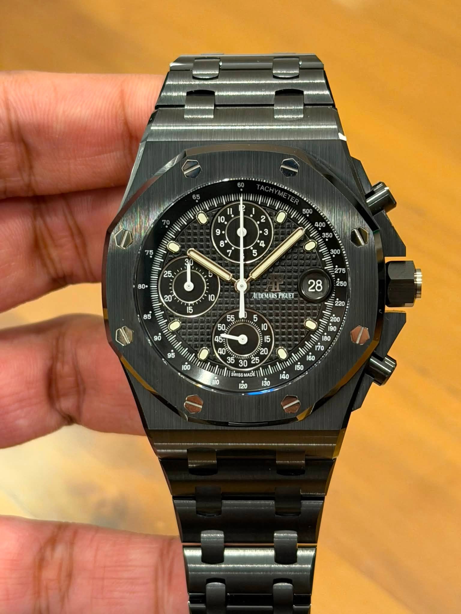 May be an image of wrist watch and text