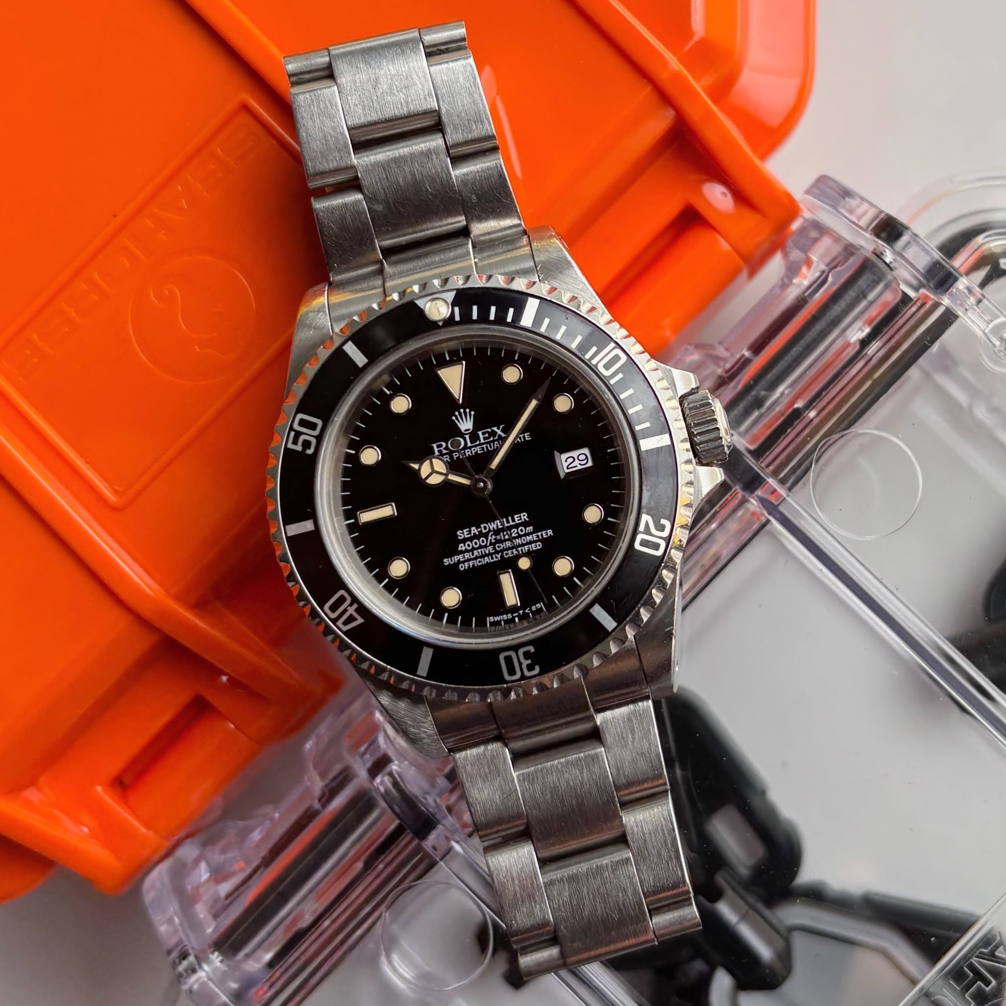 May be an image of wrist watch and text