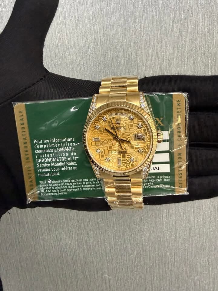 May be an image of wrist watch and text
