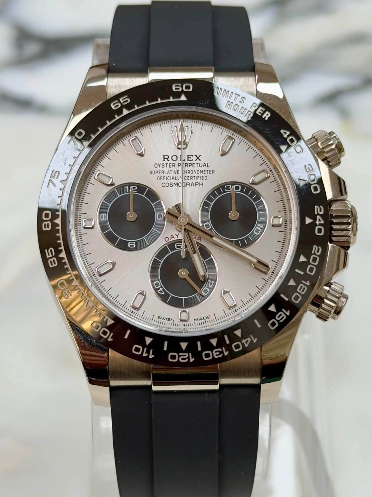May be an image of wrist watch and text that says '60 65 م menpor 70 บา 0 RO1 ROLEX EX ERPETUAL 0 12 SUPERLATIVE HDONOMETE ER OFFICIALE OFFICIALLY CERTIFIED COSMOGRAPH COSMO 30…
