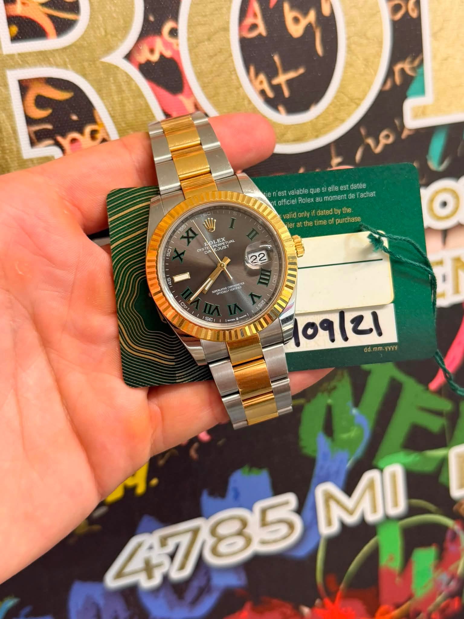 May be an image of wrist watch and text