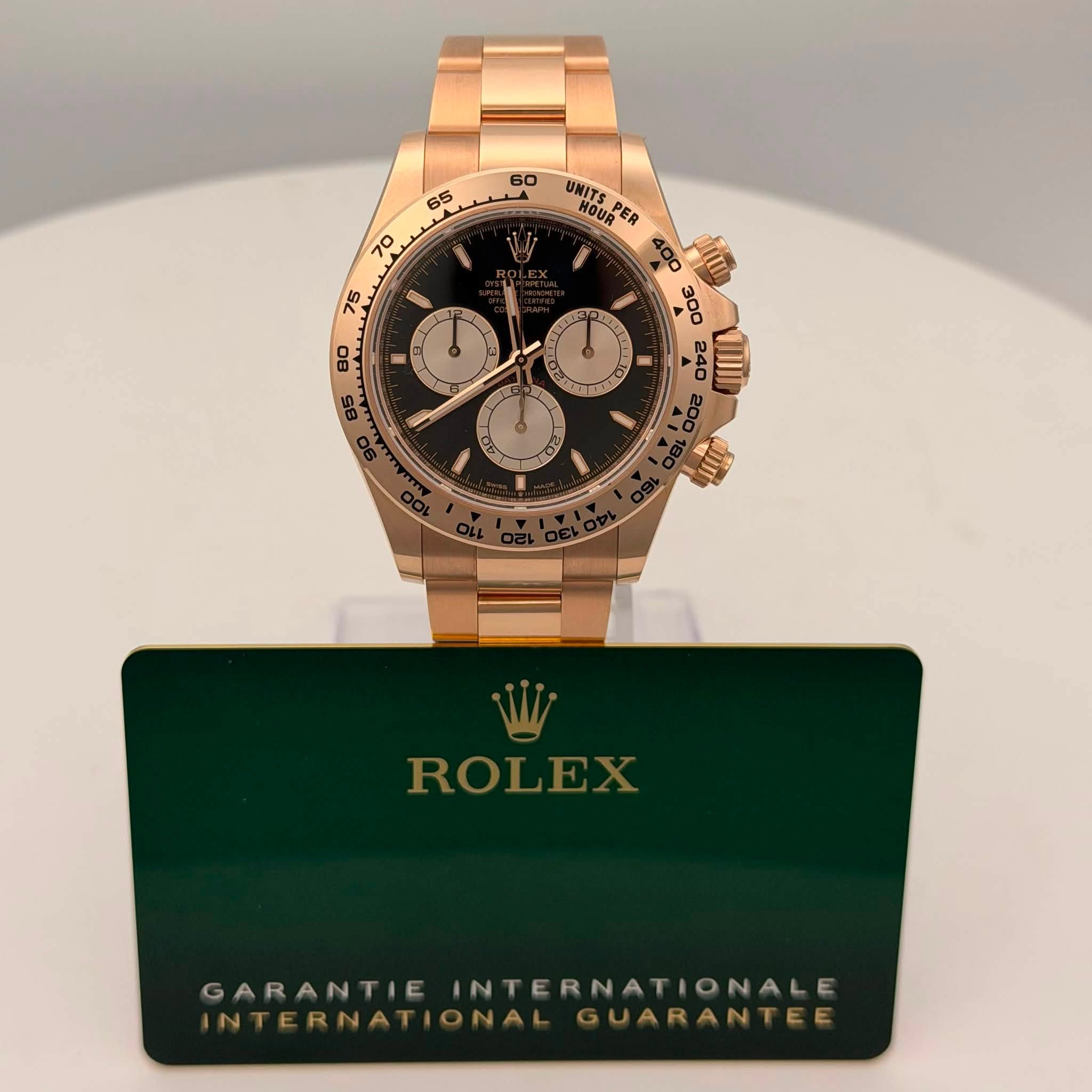 May be an image of wrist watch and text that says ' UNITS HOUR PER DA II O عد 風 ROLEX GARANTIE INTERNATIONALE GARANTIEINTERNATIONALE ATIONALE INTERNATIONAL…