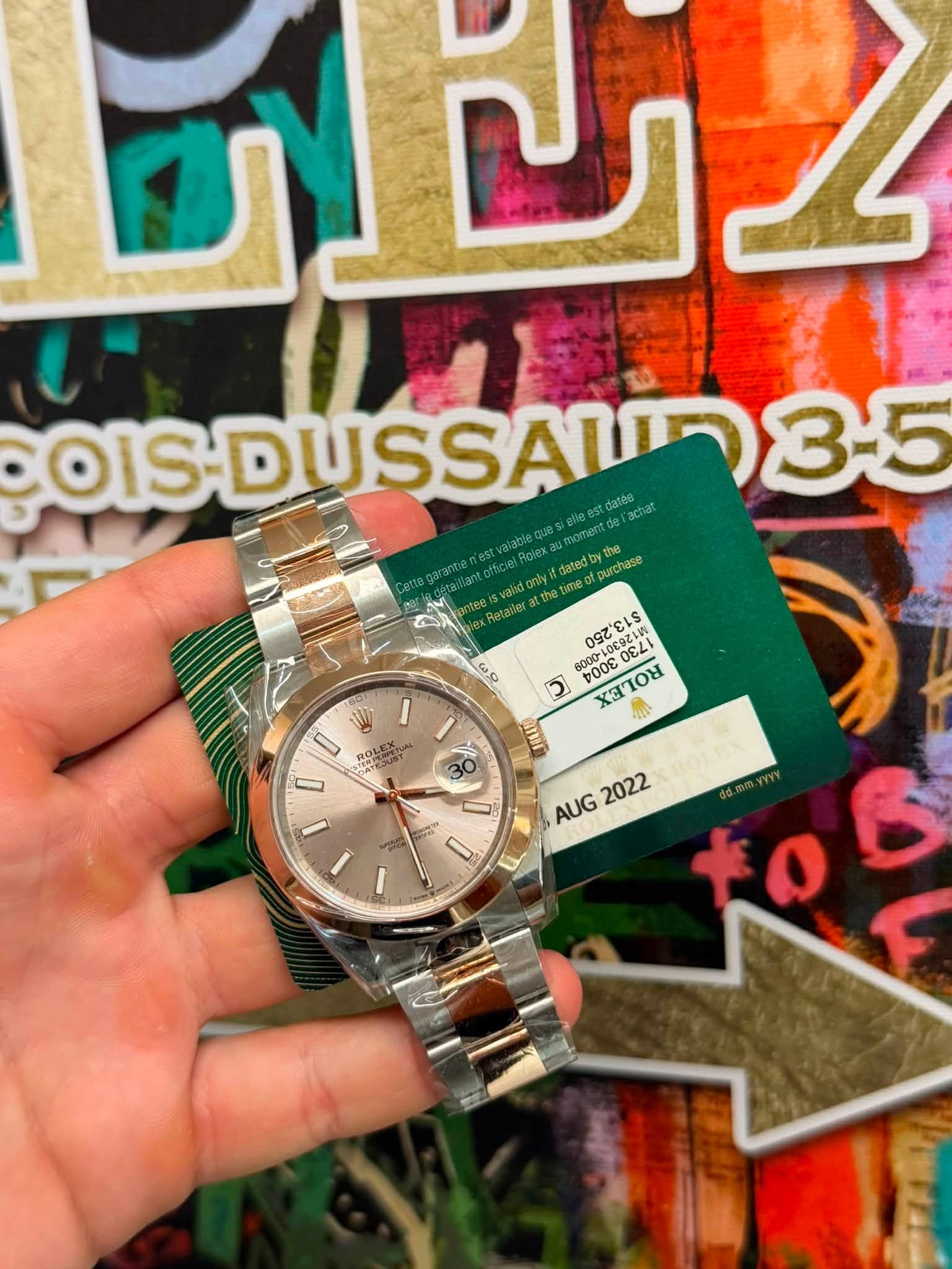 May be an image of wrist watch and text