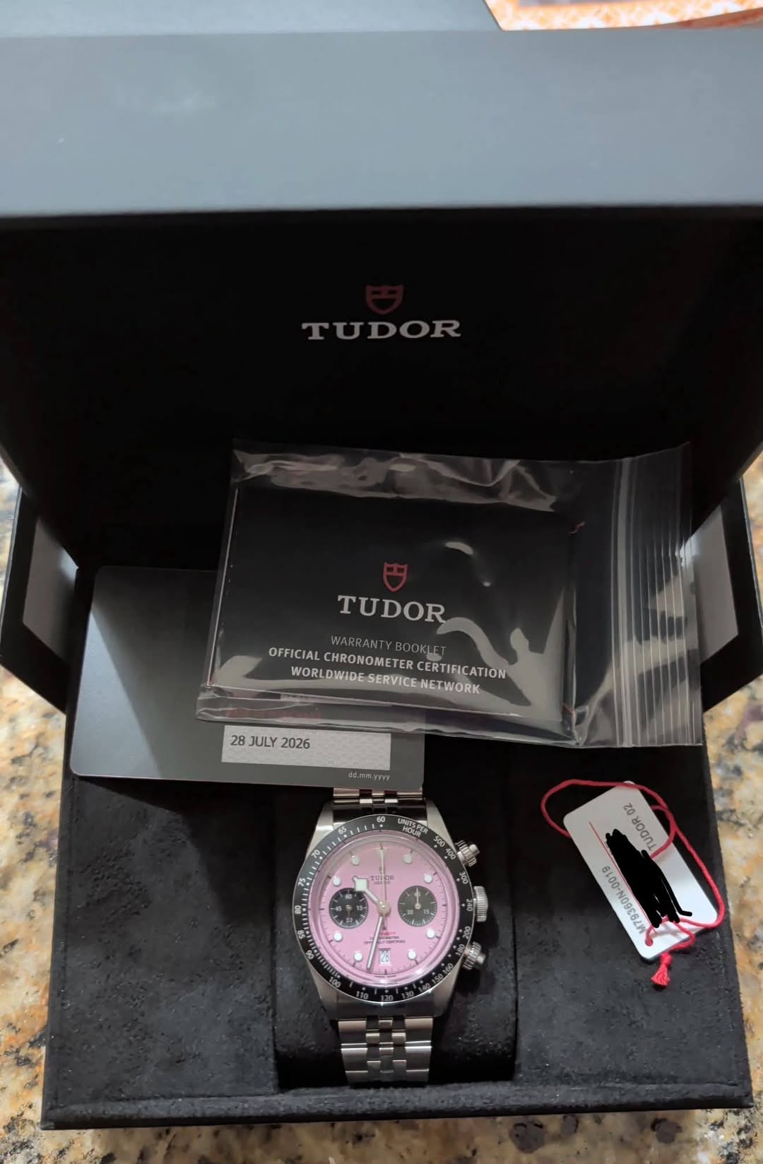 May be an image of wrist watch and text