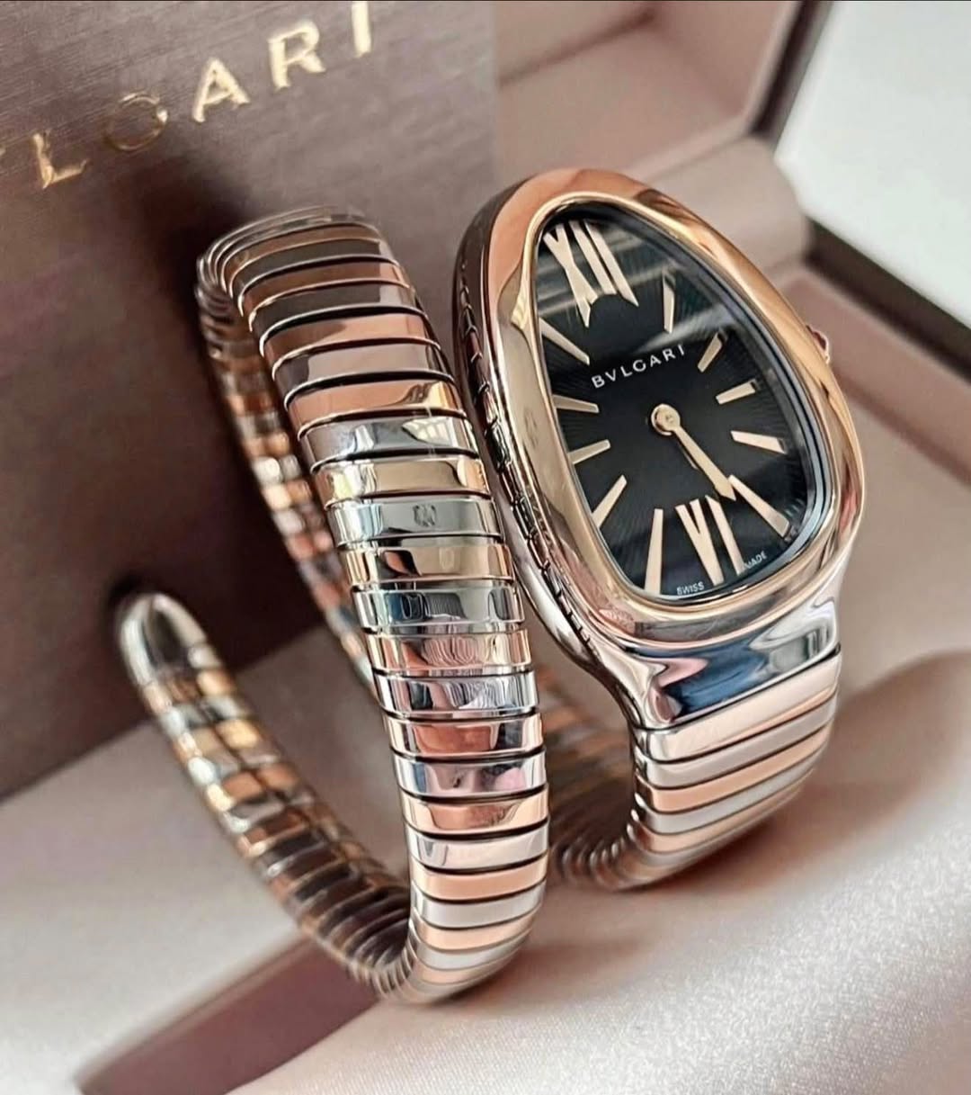 May be an image of wrist watch and text that says '北 B U BVLGARI لَ GA I 0 MADE SWISS CN'
