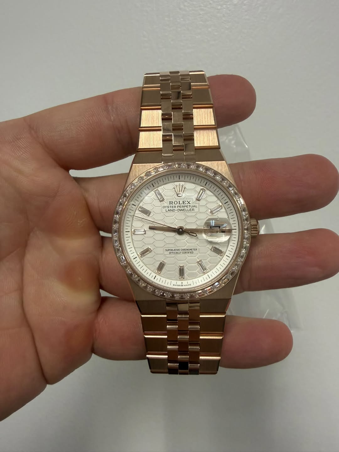 May be an image of wrist watch and text
