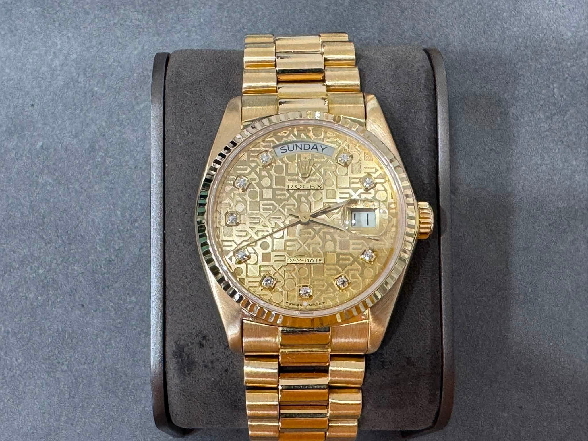May be an image of wrist watch and text