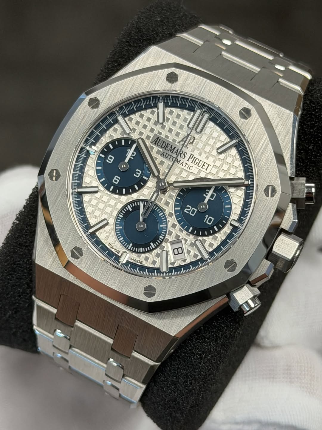 May be an image of wrist watch and text