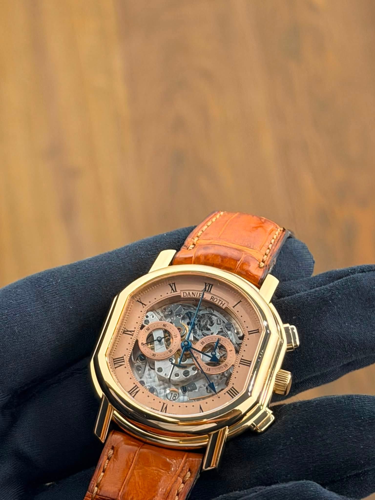 May be an image of wrist watch and text that says 'XI DANIE ROTH و 0 IIIA II. S .III. VII. 18 IA III'