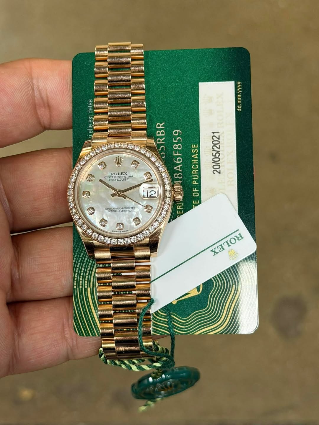 May be an image of wrist watch and text