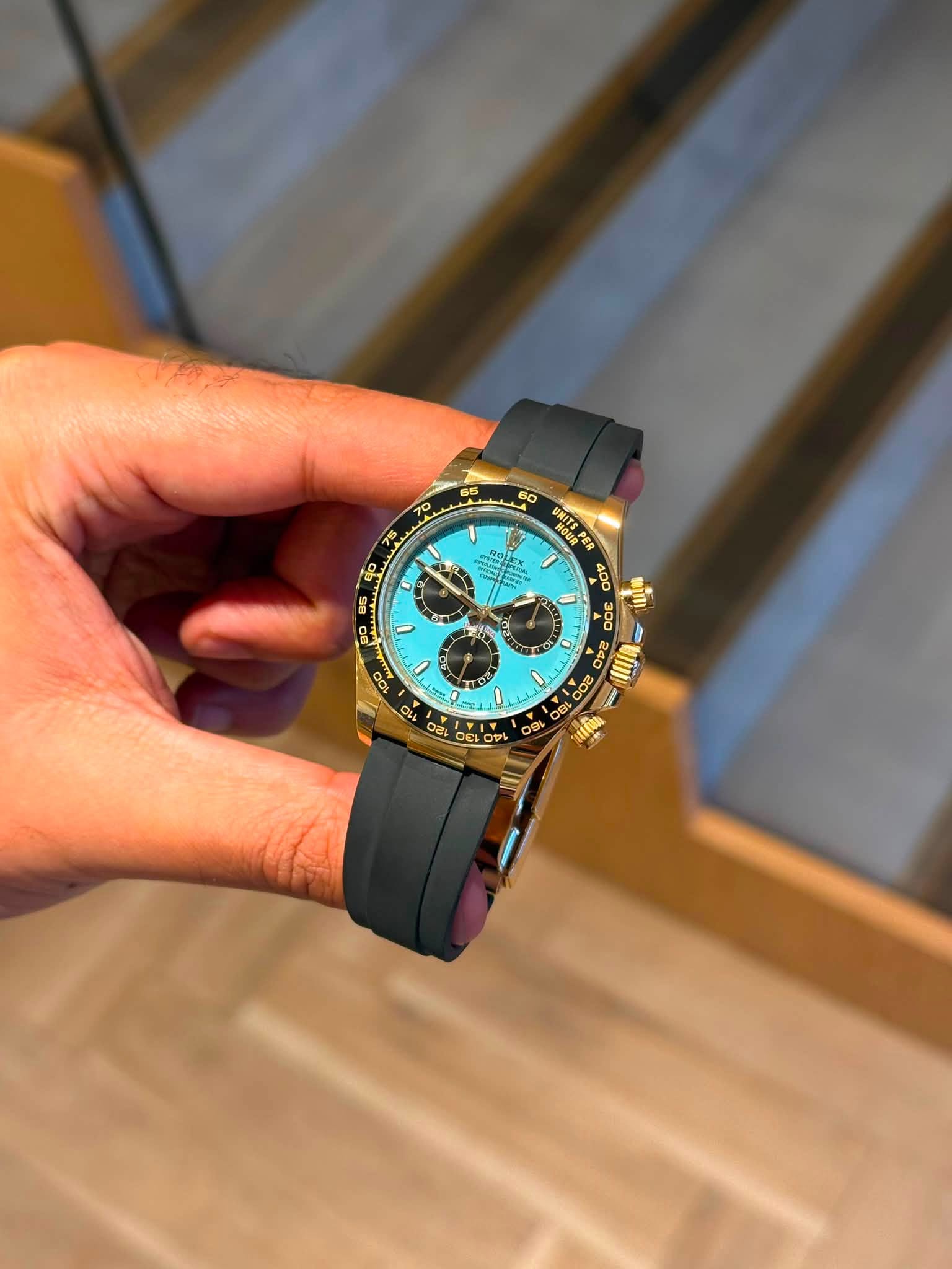 May be an image of wrist watch and text