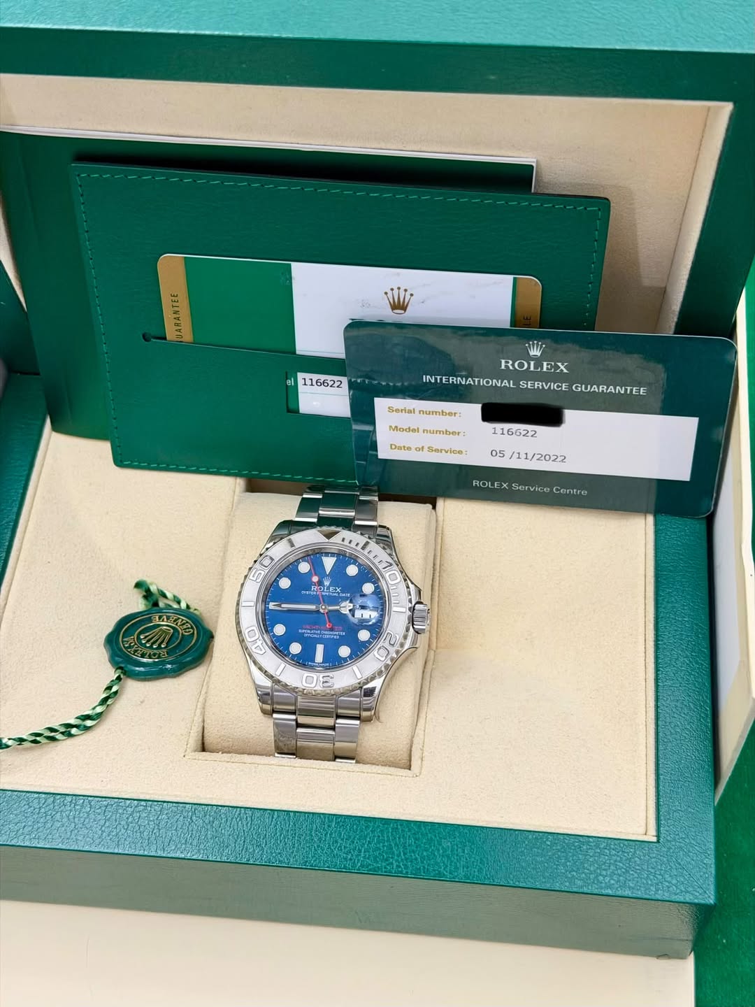 May be an image of wrist watch and text that says '6AЛTEE el 116622 مملنا ROLEX ROI INTERNATIONAL INTERNATIONALSERVICEGUARANTEE SERVICE GUARANTEE Surlal number: Model Model…