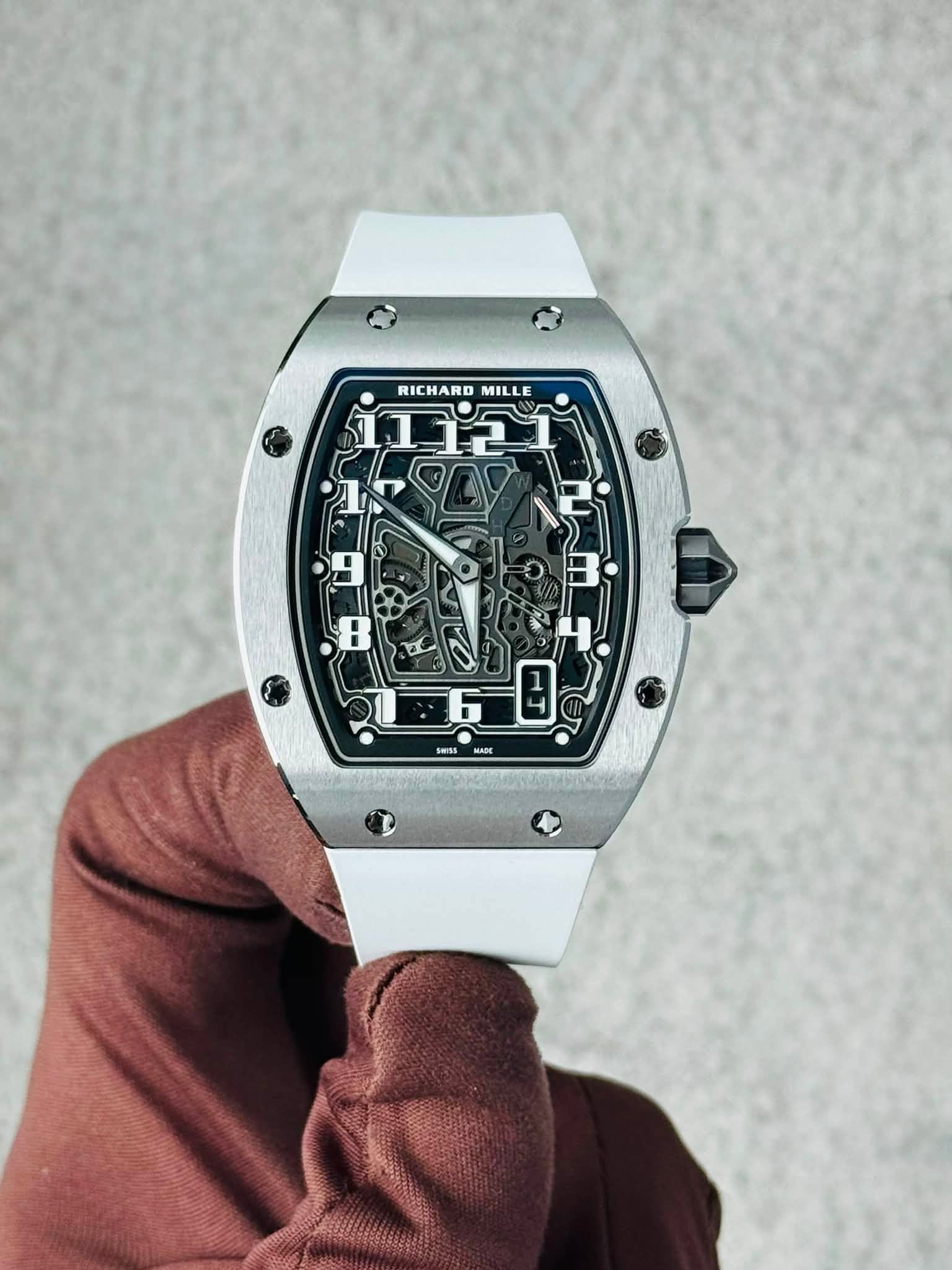 May be an image of wrist watch and text that says 'RICHARD RICHARDMILLE MILLE ג2בב1 9 : = F SwSs'