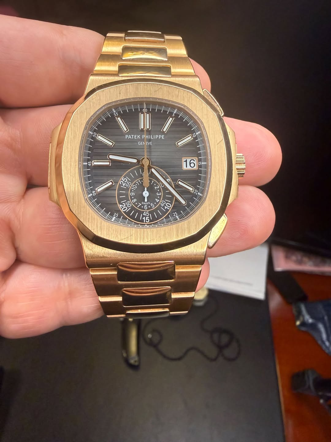 May be an image of wrist watch and text