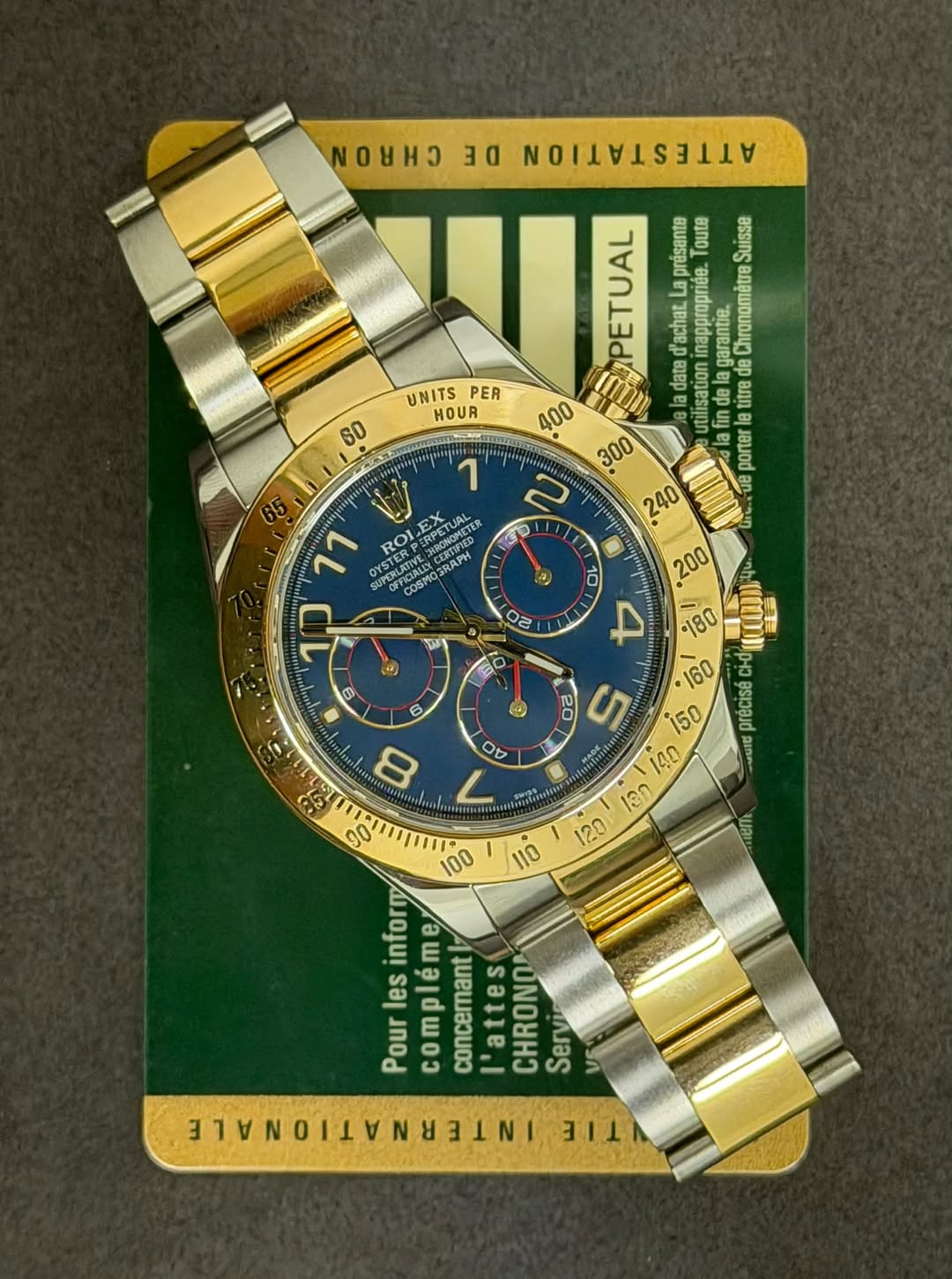 May be an image of wrist watch and text that says 'mиH3 DE VATTATTIITO UNITS PER HOUR 60 0 11 OYSTER ROI KPTER CUPORLATIVE SUPERLATIV presante oute Suisse d'achat. πaρroρηεε…
