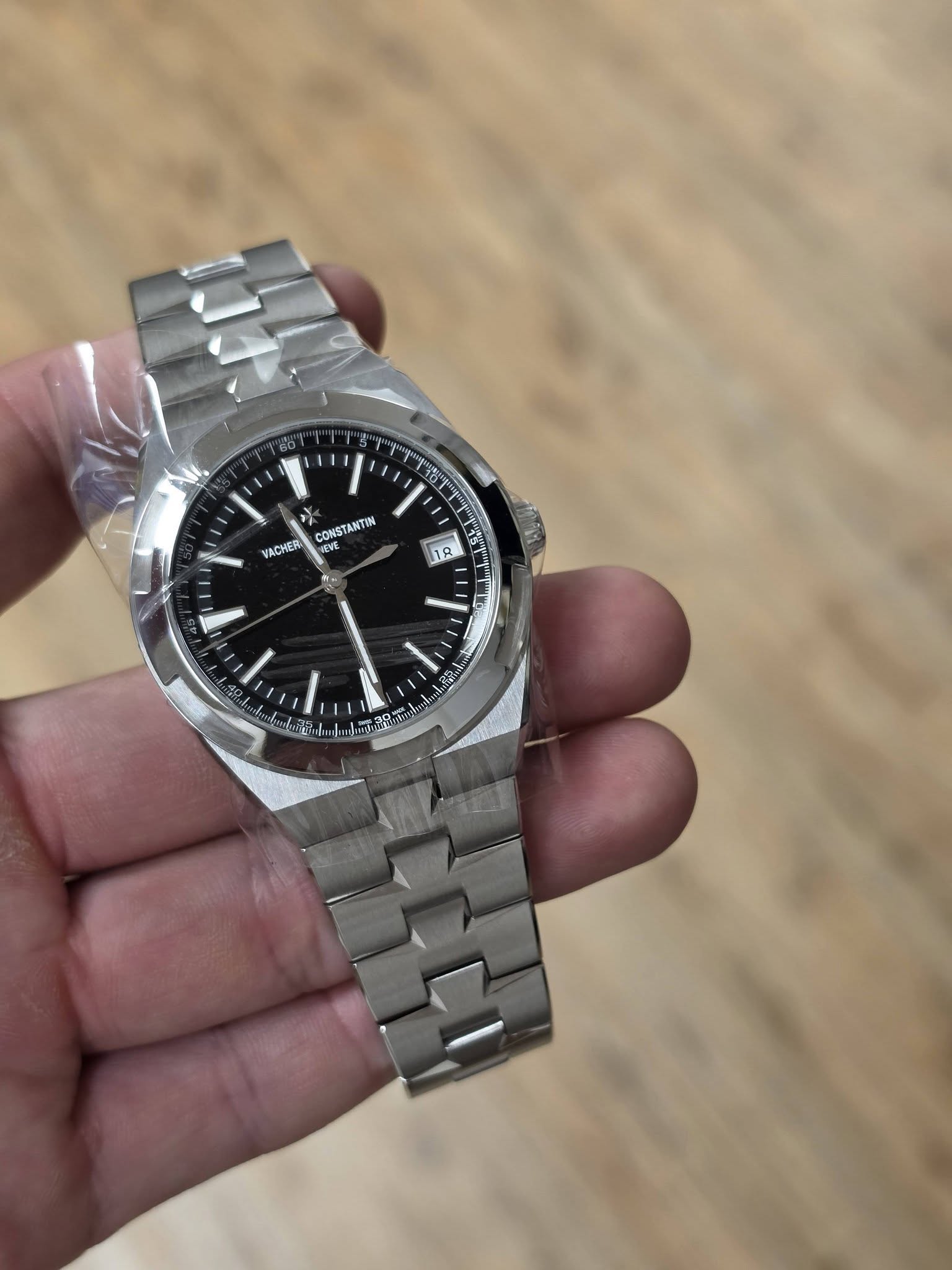 May be an image of wrist watch and text