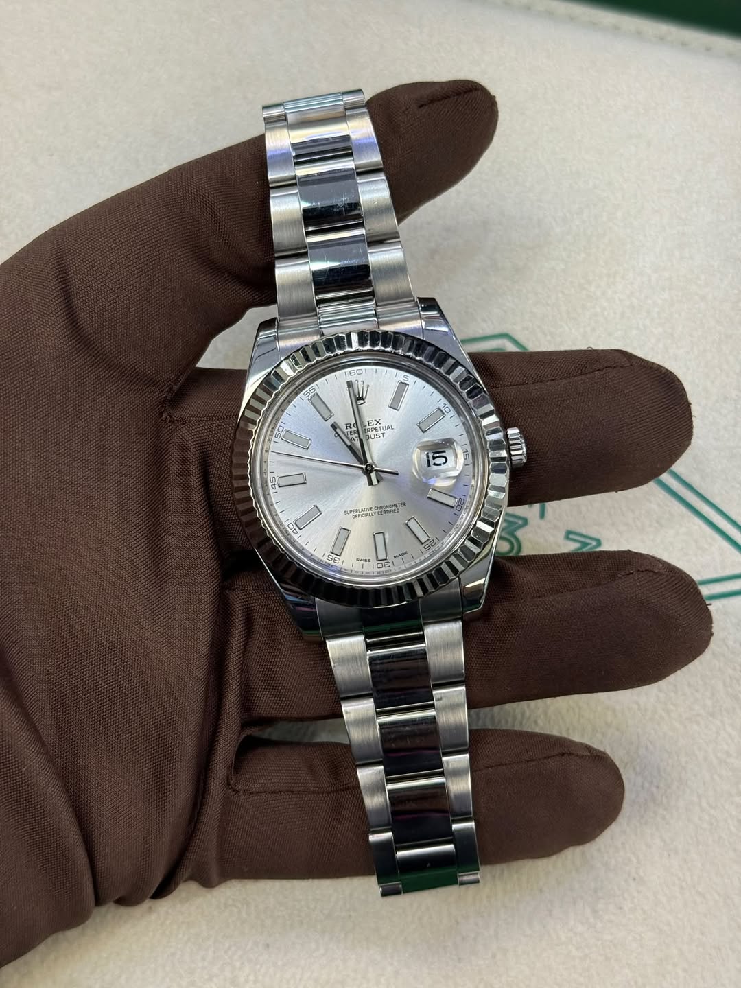 May be an image of wrist watch and text