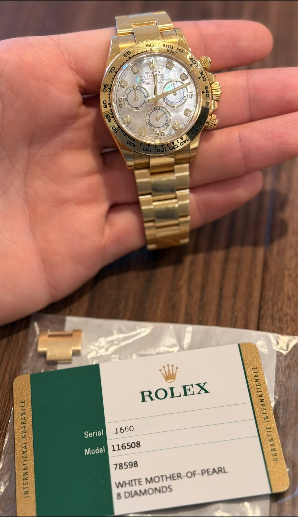 May be an image of wrist watch and text that says '60 우솔소지3 80 15 .ውፓርስስት र S 0 0 O0 ROLEX TERNATIONALE ARANTIEINTERNATIONALE GARANTIE Serial 1650 Model WHITE MOTHER-OF-PEARL…