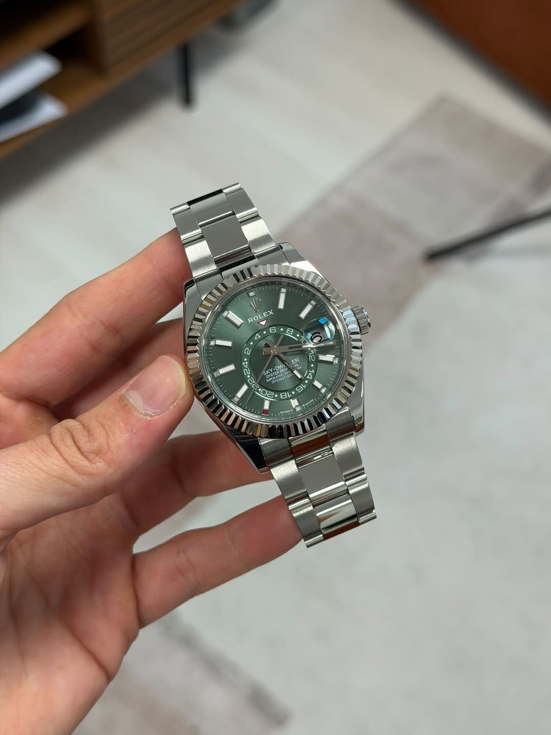 May be an image of wrist watch and text