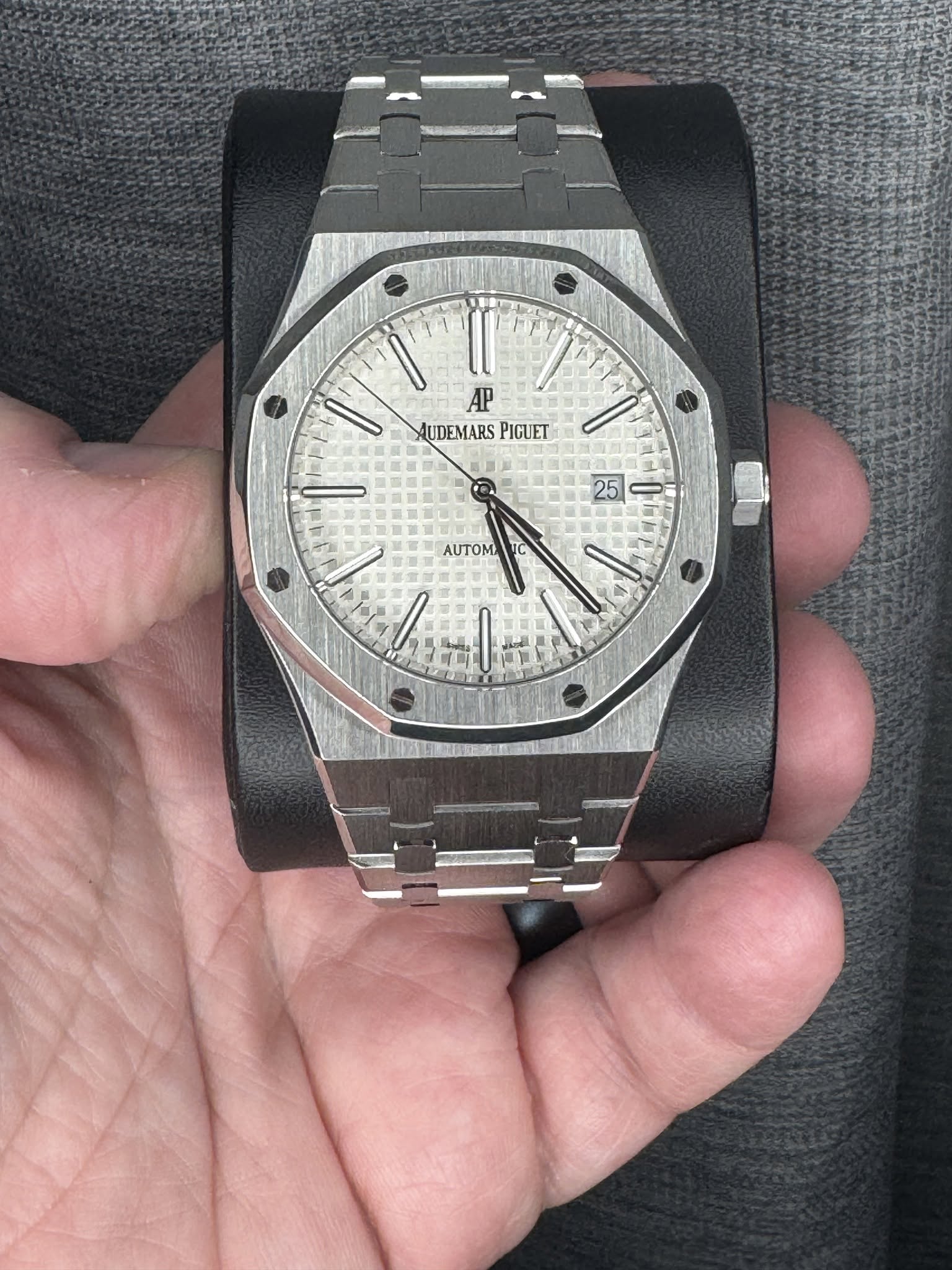 May be an image of wrist watch and text