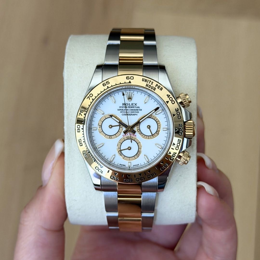 May be an image of wrist watch and text