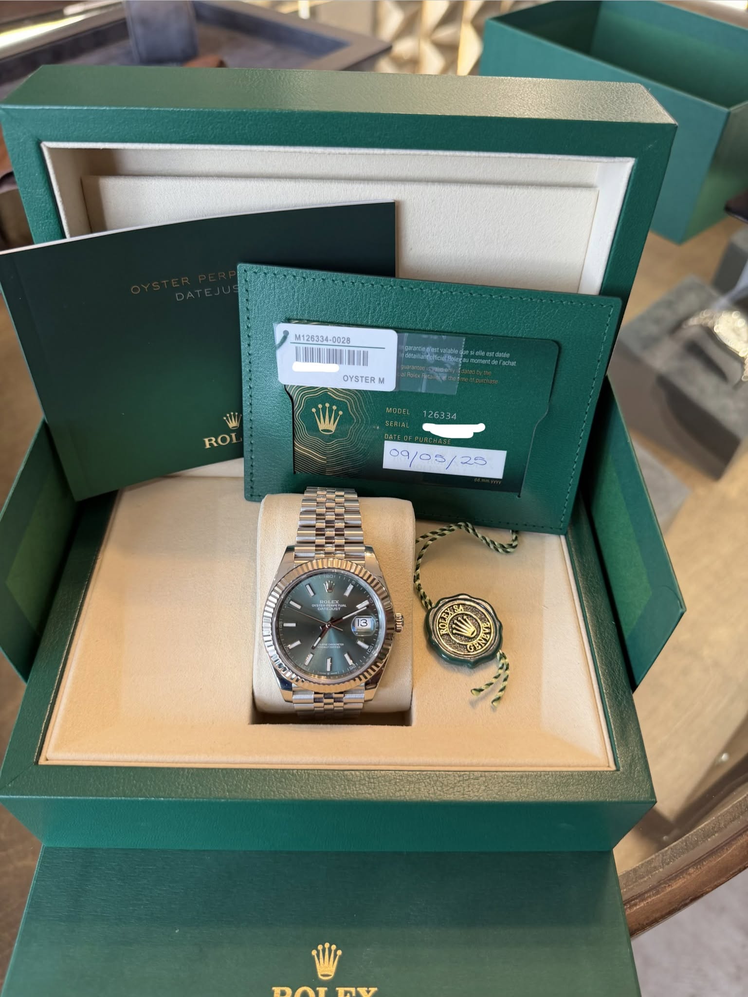 May be an image of wrist watch and text