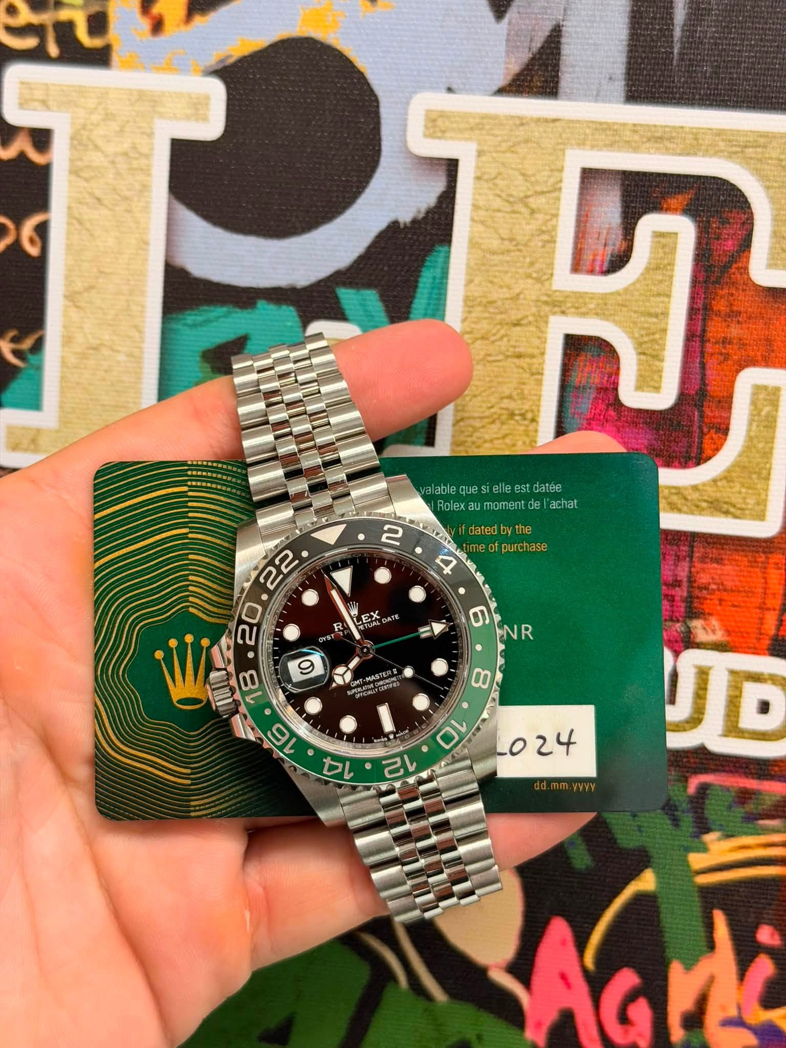May be an image of wrist watch and text