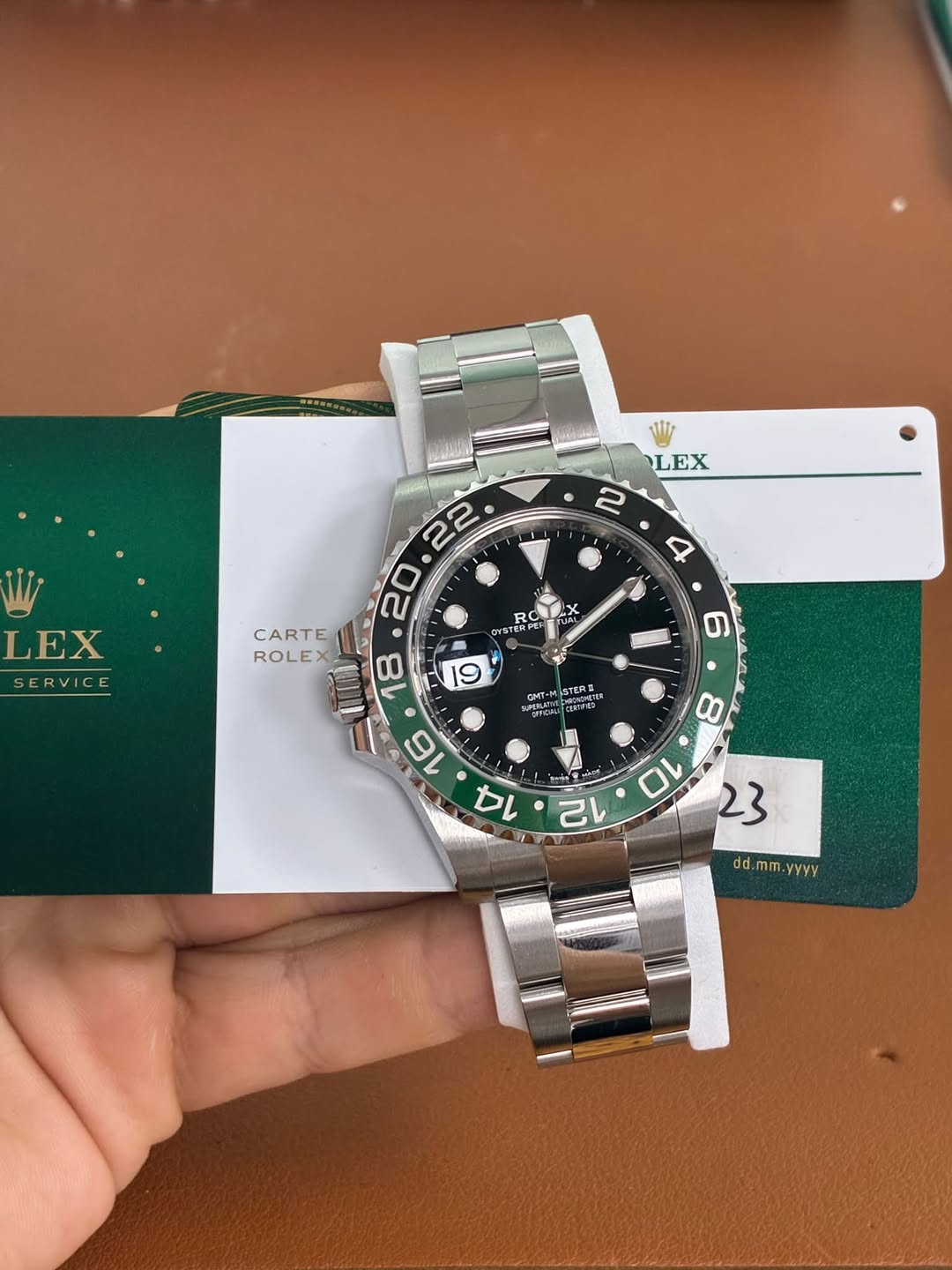 May be an image of wrist watch and text