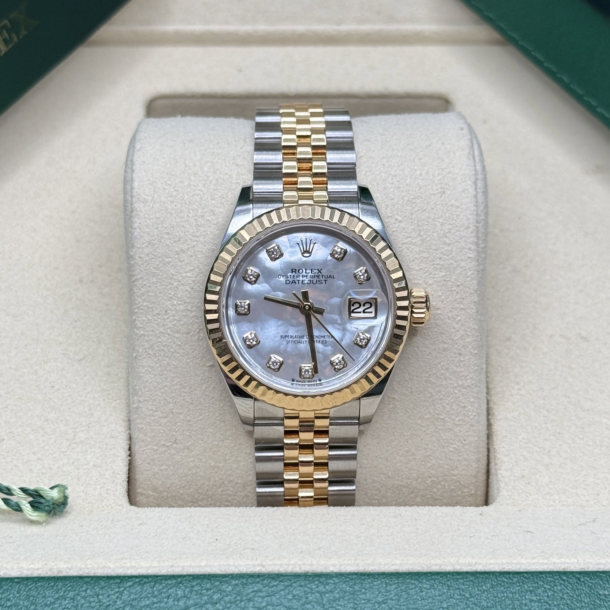 May be an image of wrist watch and text